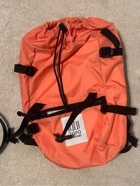 Topo Designs Coral Orange Drawstring Backpack with Black Straps